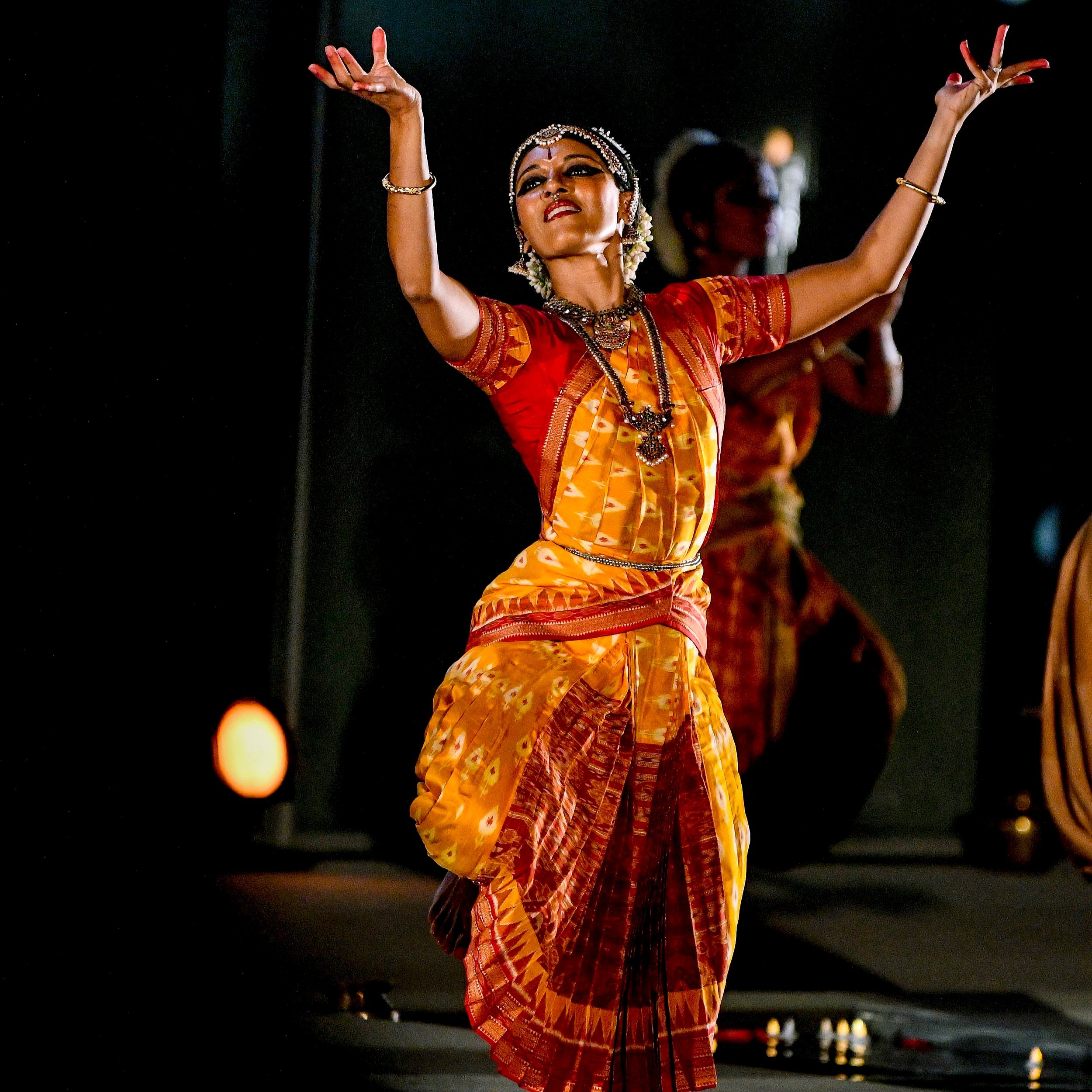 Aparna Ramaswamy, an Indian-American, dances in traditional Bharatanatyam clothing