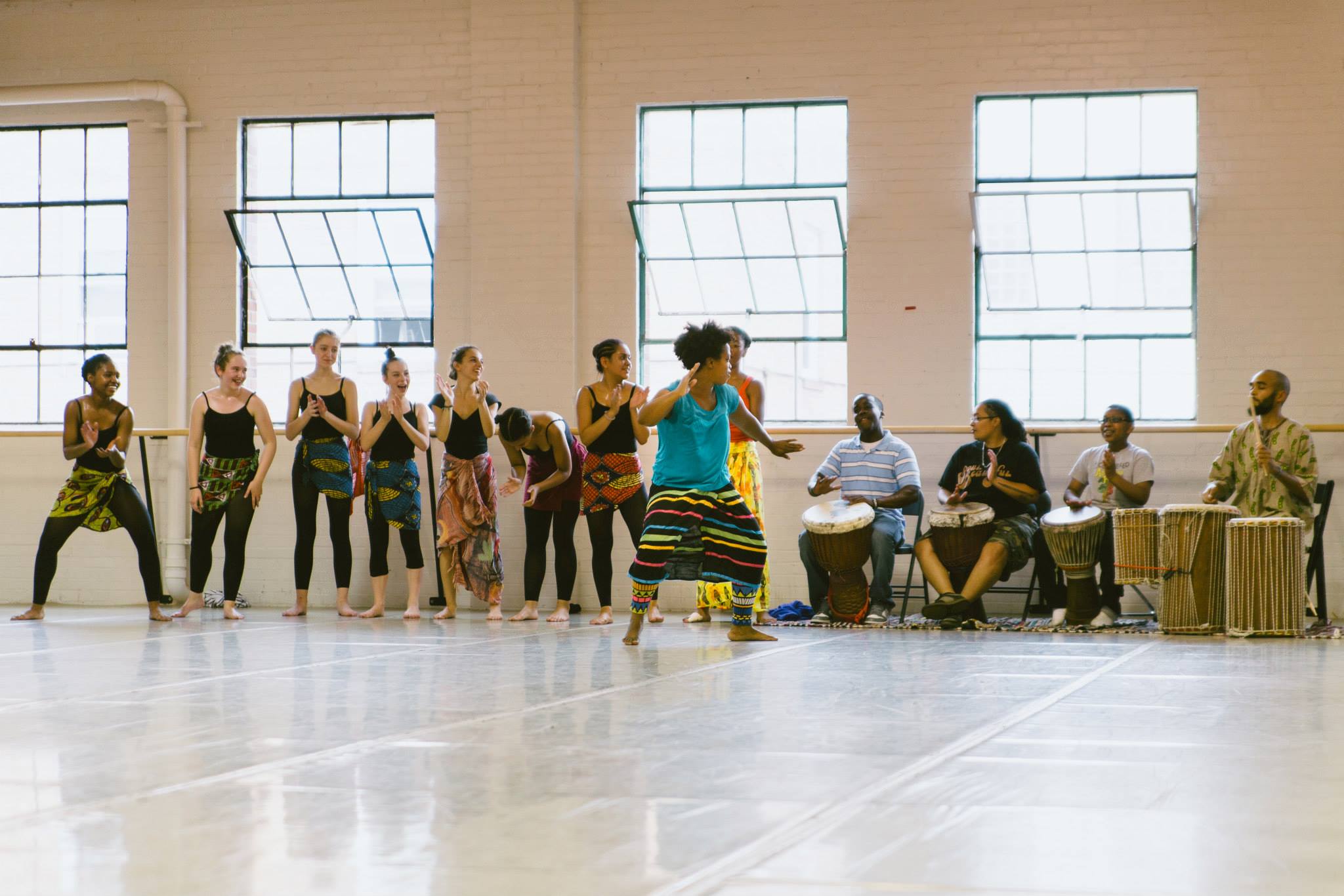 Dancer and Teaching Artist Kenna Cameron-Cottman leads a class of dancers and drummers at TU Dance Center